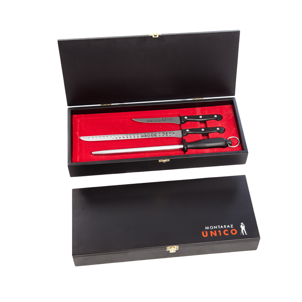 Set of 2 ham knives and a sharpener in a black box with red inside by Montaraz. Deliberico