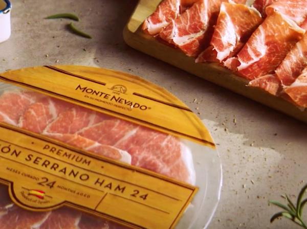 Serrano Ham Monte Nevado Plate packaging and ham over a wood board