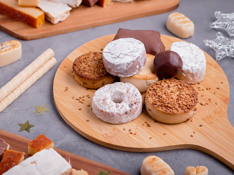 Assorted Spanish Christmas Sweets on a round wood board