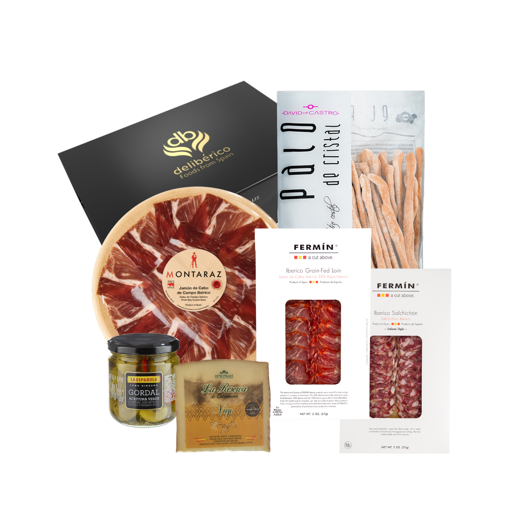 Deliberico's 'Clásica' Gift Box is a refined selection of artisan charcuterie, fine cheese, olives and breadsticks. Elegantly packaged in our signature black and gold boxes, it’s the perfect choice for any occasion, offering a tasteful experience to savor and share.