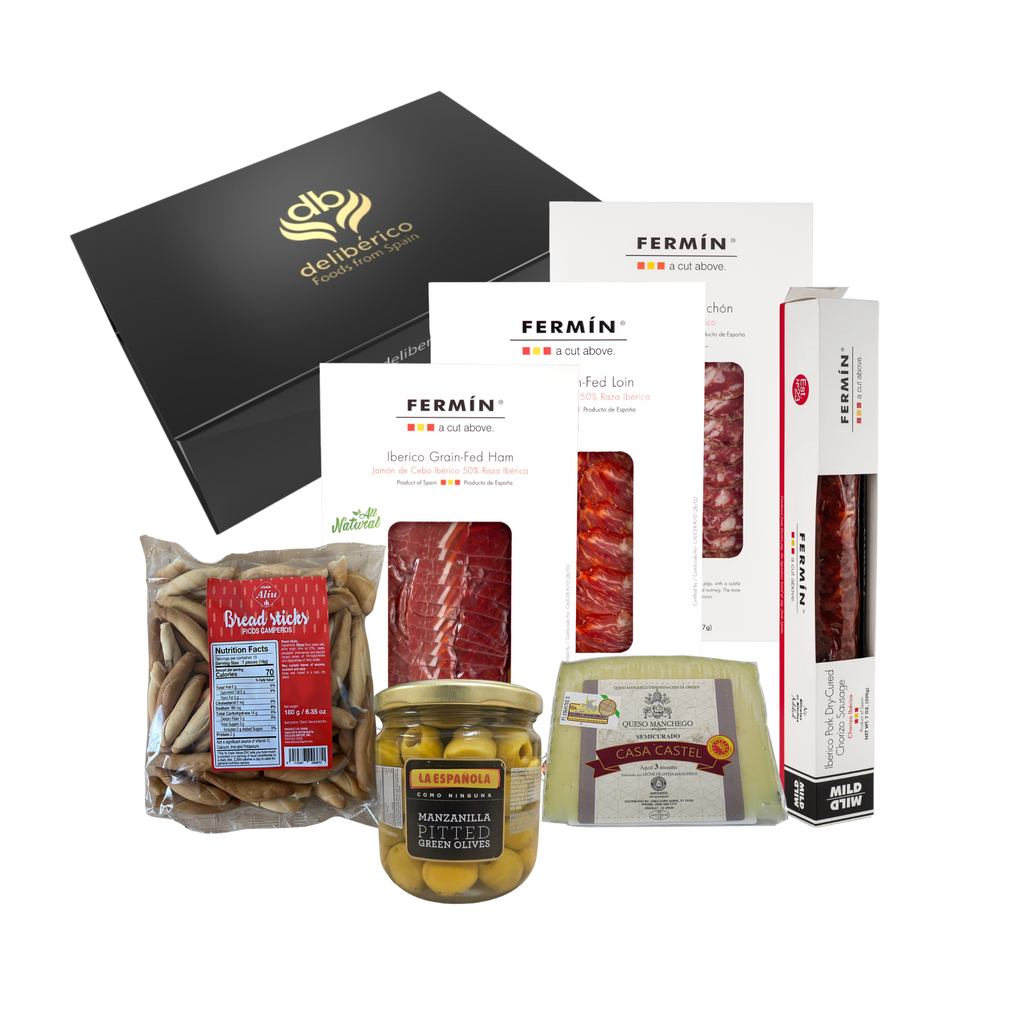 Deliberico's 'Dehesa' Gift Box offers artisan charcuterie, fine cheeses, olives, and breadsticks in elegant black and gold packaging—perfect for gifting or sharing!