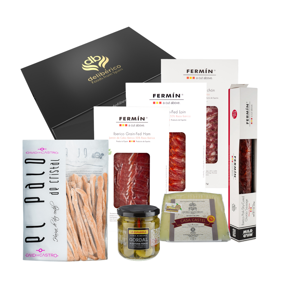 Deliberico's 'Dehesa' Gift Box offers artisan charcuterie, fine cheeses, olives, and breadsticks in elegant black and gold packaging—perfect for gifting or sharing!