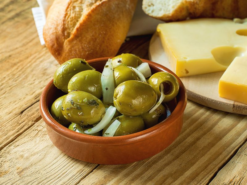 Gordal pitted olives in a clay dish