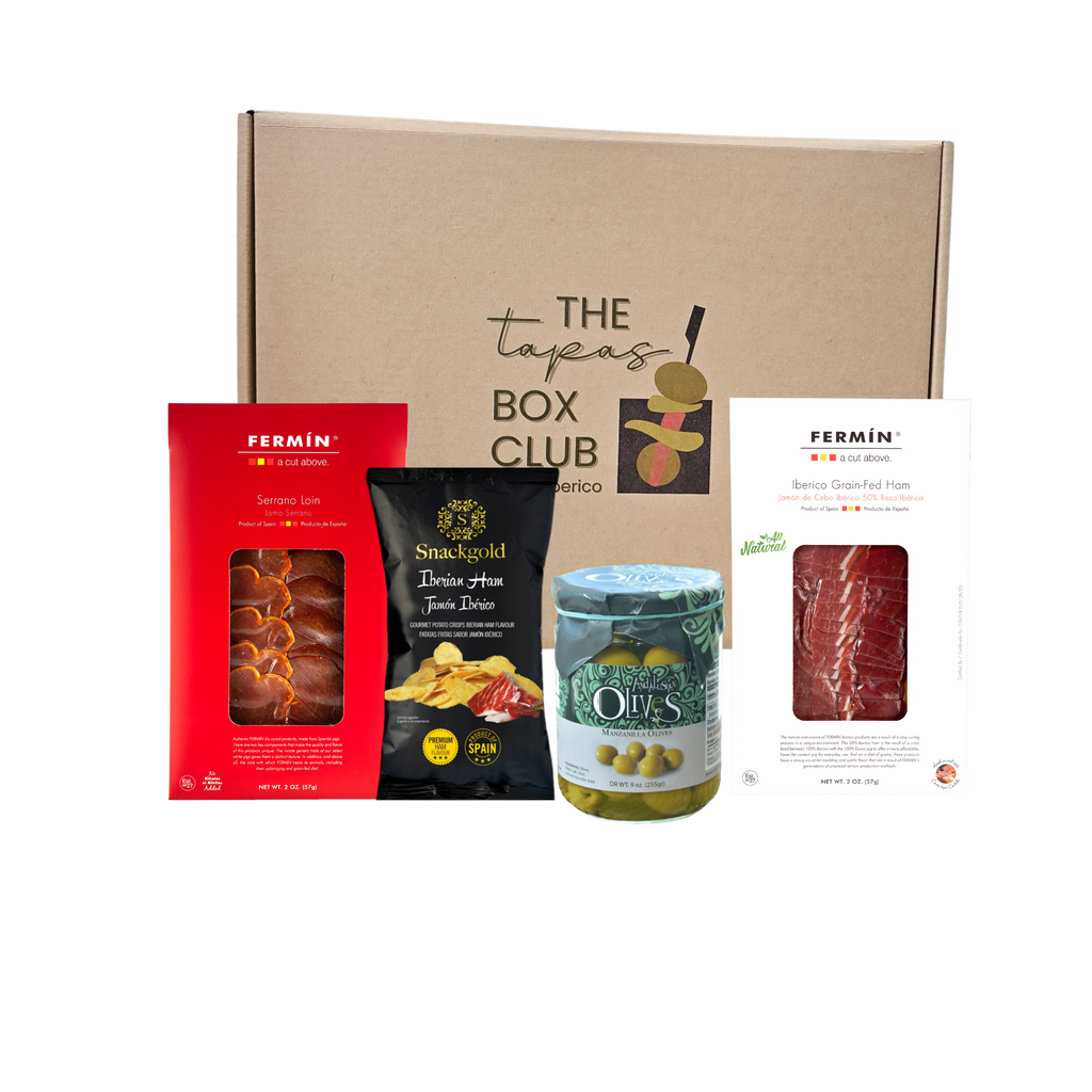 Iberico & Crunch Tapas Box including Ibérico ham, Serrano loin, manzanilla olives, and Ibérico ham chips in this indulgent Spanish tapas. The Tapas Box Club by Deliberico