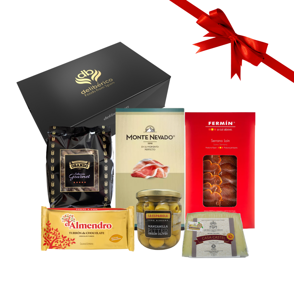 Let it snow gift box includes Serrano Ham and Loin, Breadsticks, manzanilla olives , manchego cheese and chocolate crunchy turron in a Deliberico black gift box