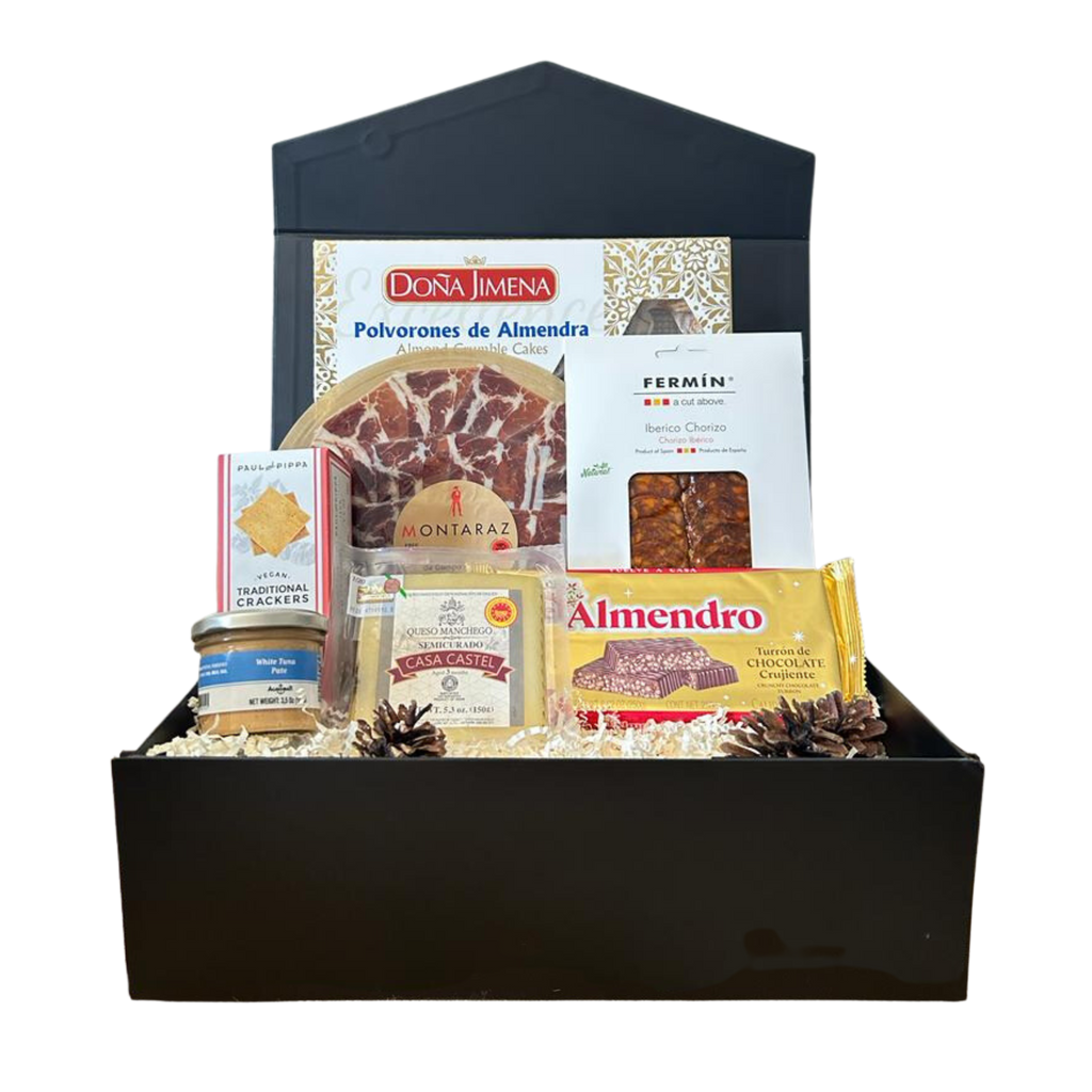     Let it snow gift Box is a celebration of Christmas with a salection of Ham, chorizo, manchego cheese, tuna pate and crackers, polvorones and chocolate crunchy nougat in a black and golden accents box