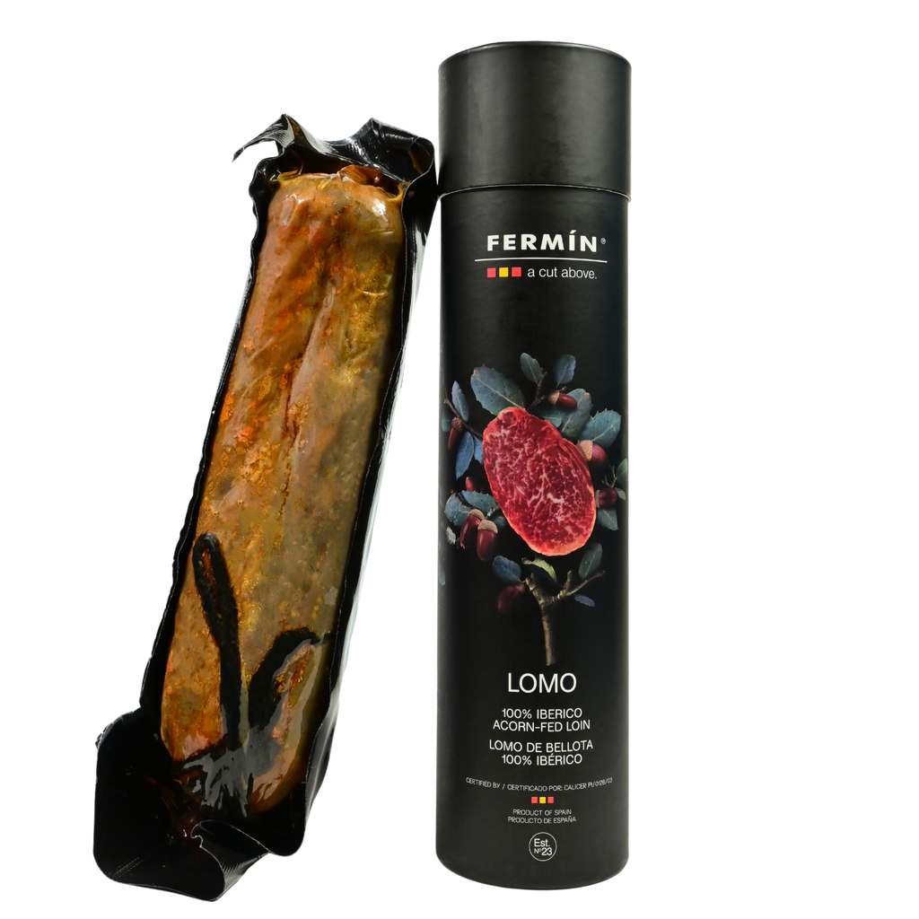 Iberico Acorn fed loin tube with product nesxt to it by Fermin.Deliberico