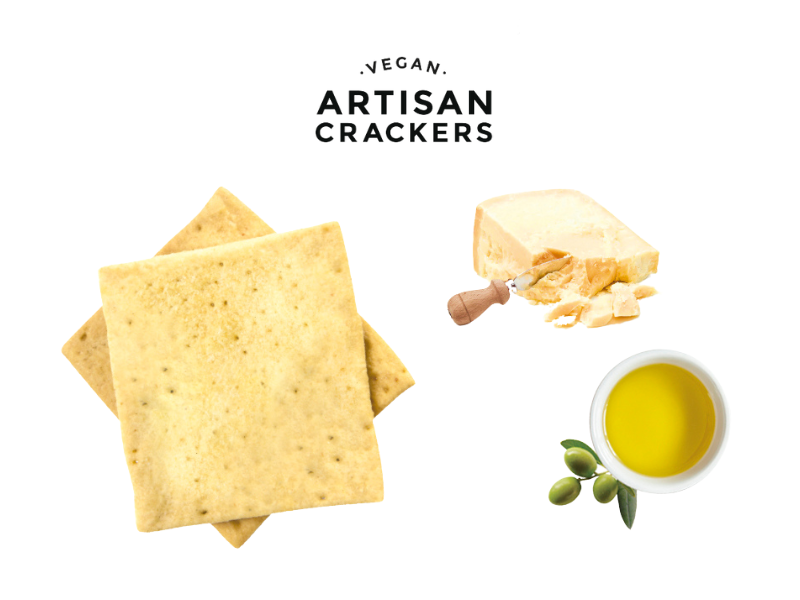 Vegetarian Parmesan Crackers by Paul & Pippa flat lay with parmesan cheese and a bowl of olive oil