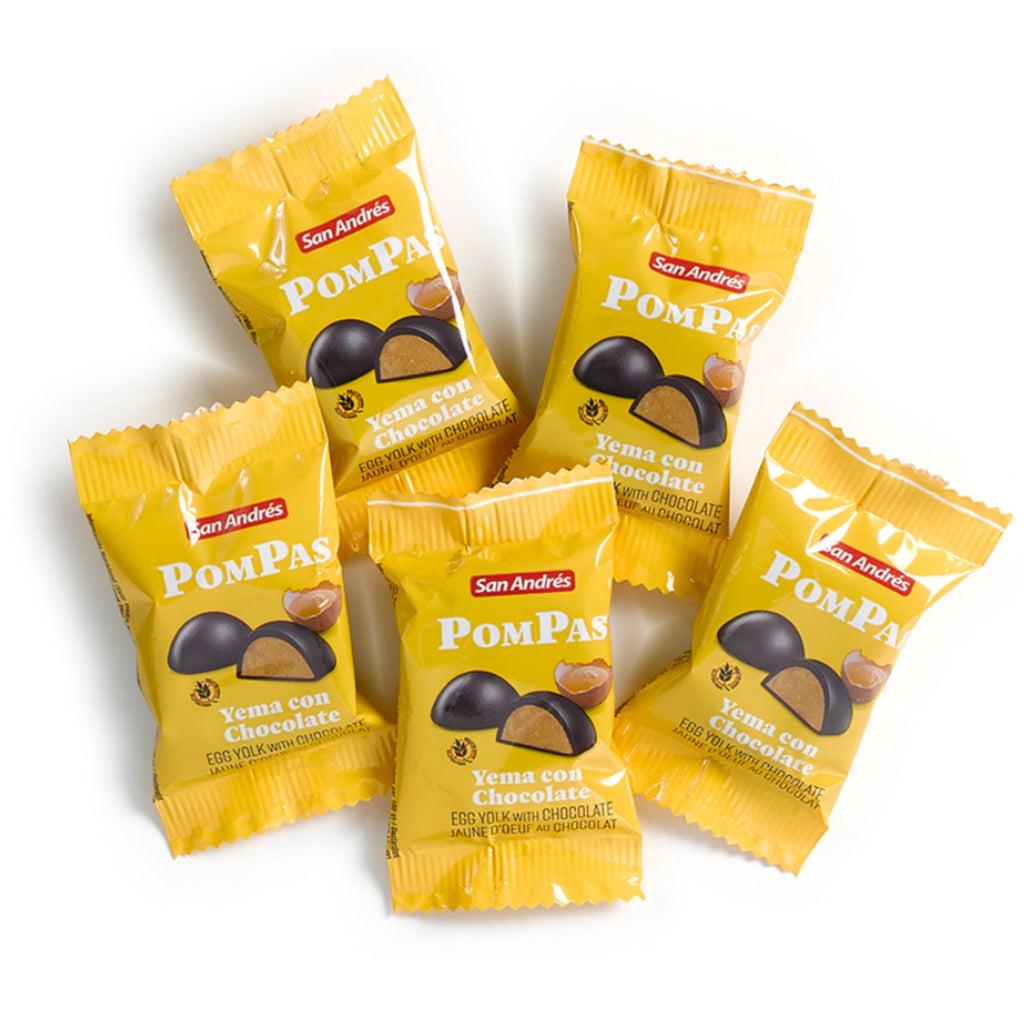 Five yellow packages of San Andres PomPas Yema con Chocolate on a white background