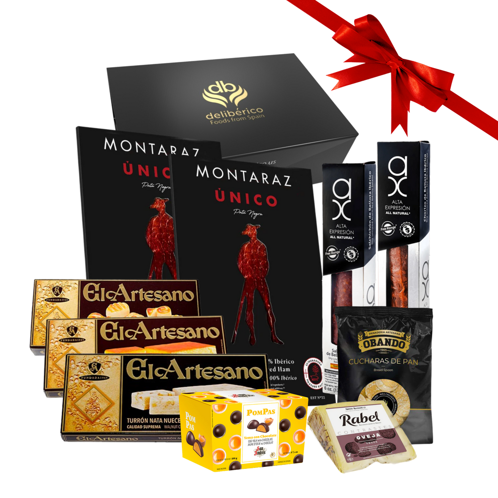 Deliberico's Rocking Around Gift Box featuring iberico ham , chorizo and salchichon, cheese and bread spoons, and delicious sweet selection , all in a premium black and gold gift box