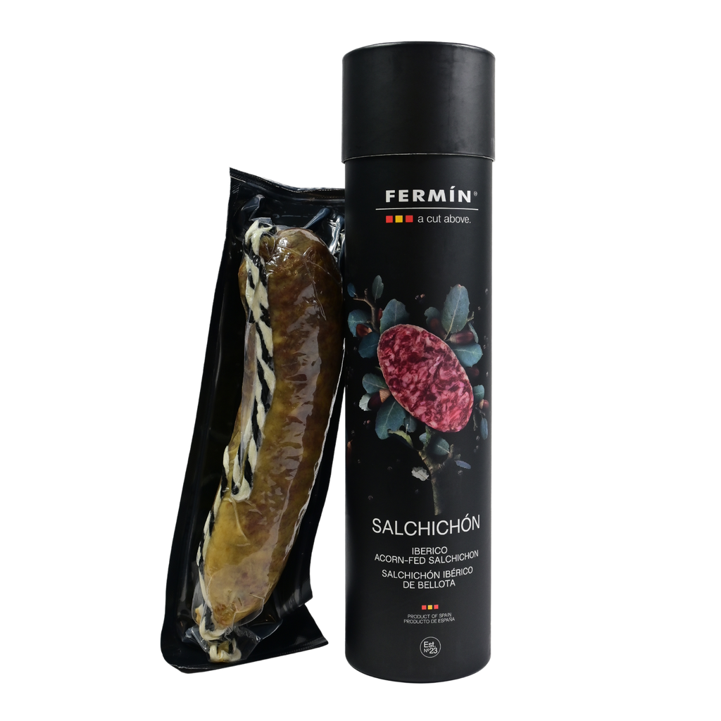 Fermin 100 Iberico acorn fed salchichon in black tube packaging with sealed product on a Transparent background