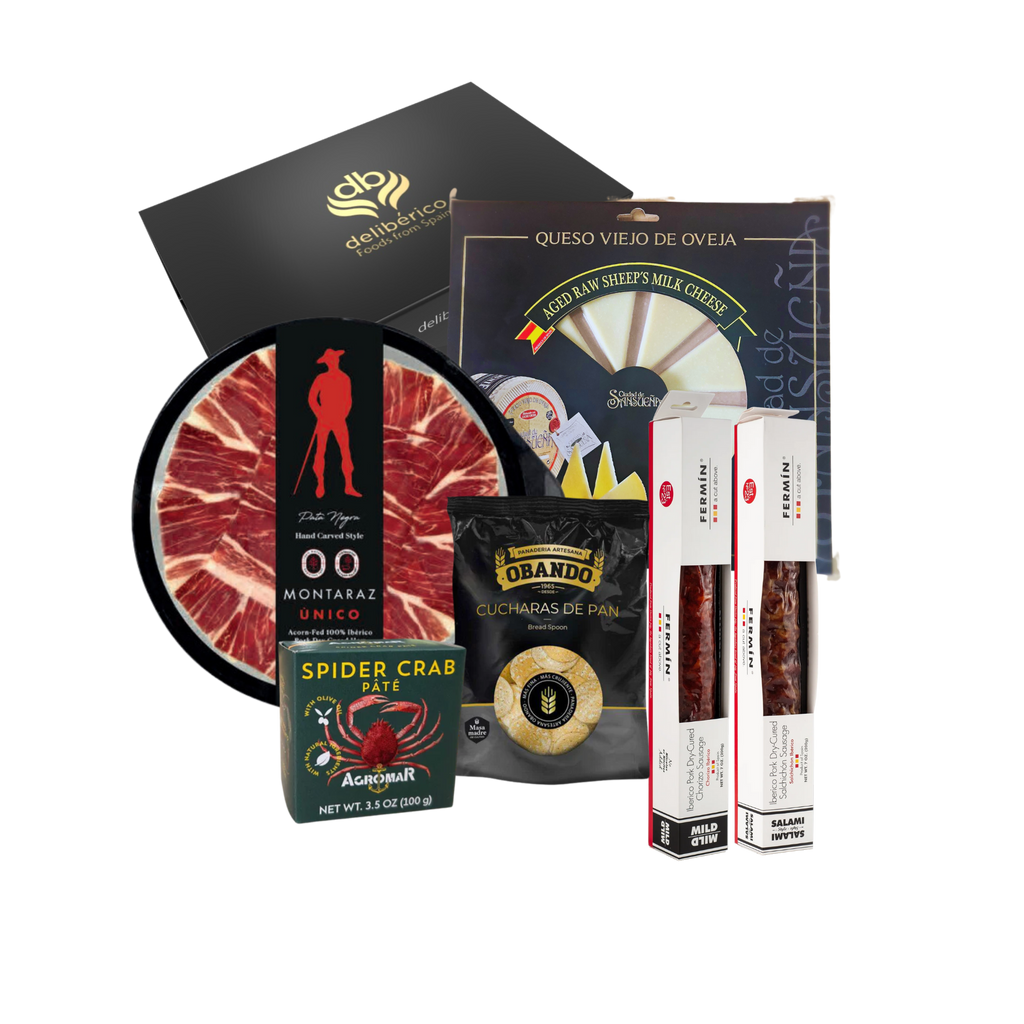 Discover the 'Solera' Gift Box: 100% Iberico Ham, artisanal Chorizo, aged sheep cheese, and Spider Crab Pâté in elegant black and gold packaging. Perfect for any occasion!