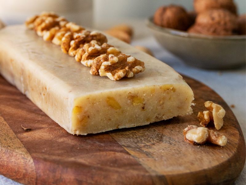 Cream and nut Nougat over a wood board