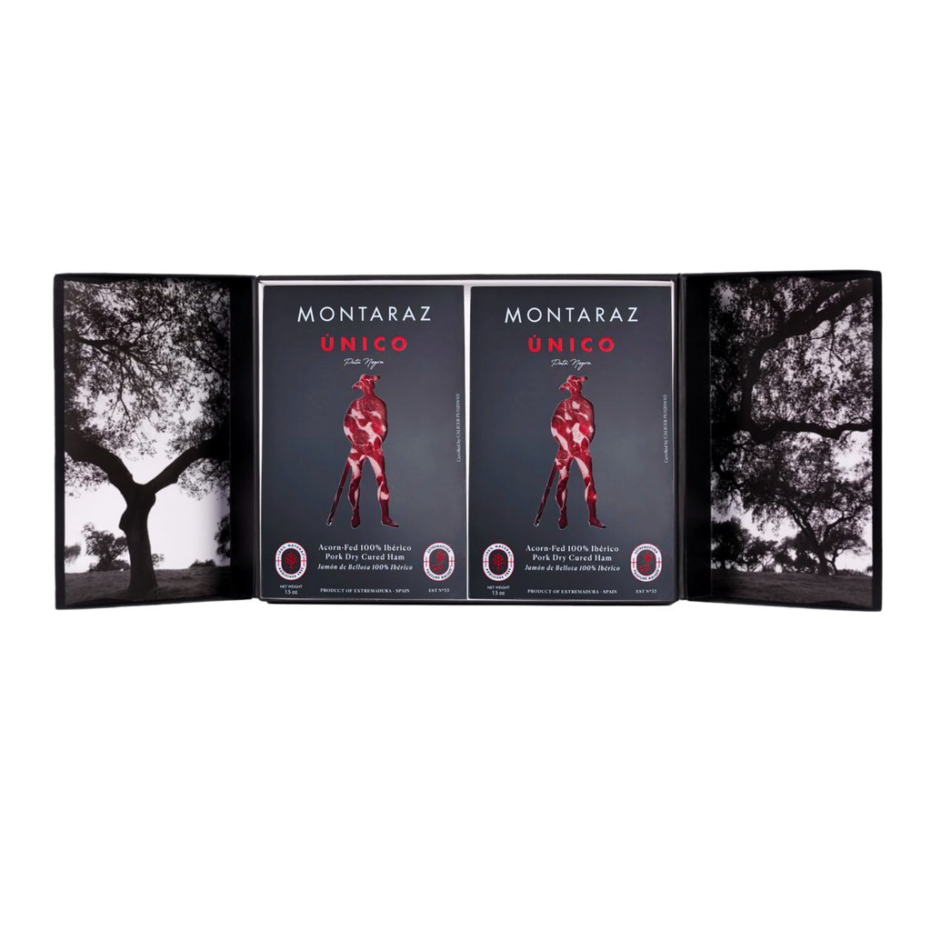 Montaraz Unico gift box opened with 2 iberico bellota ham envelopes on a transparent background