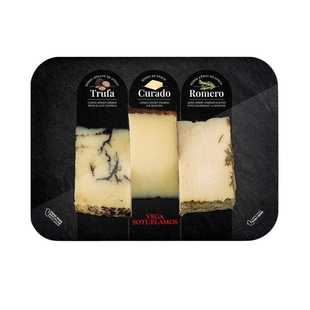 Vega Sotuelamos cheese from Castilla-La Mancha, Spain. Pre-cut Truffle, cured & rosemary sheep cheeses (3x100g) wedges on a black tray.