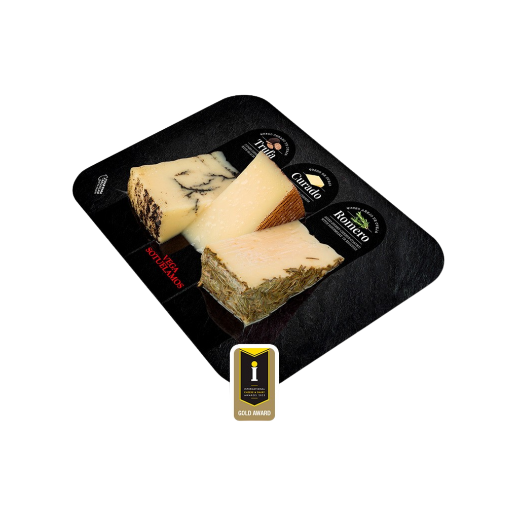 Vega Sotuelamos cheese from Castilla-La Mancha, Spain. Truffle, cured & rosemary sheep cheeses (3x100g) wedges on a black tray with an award seal