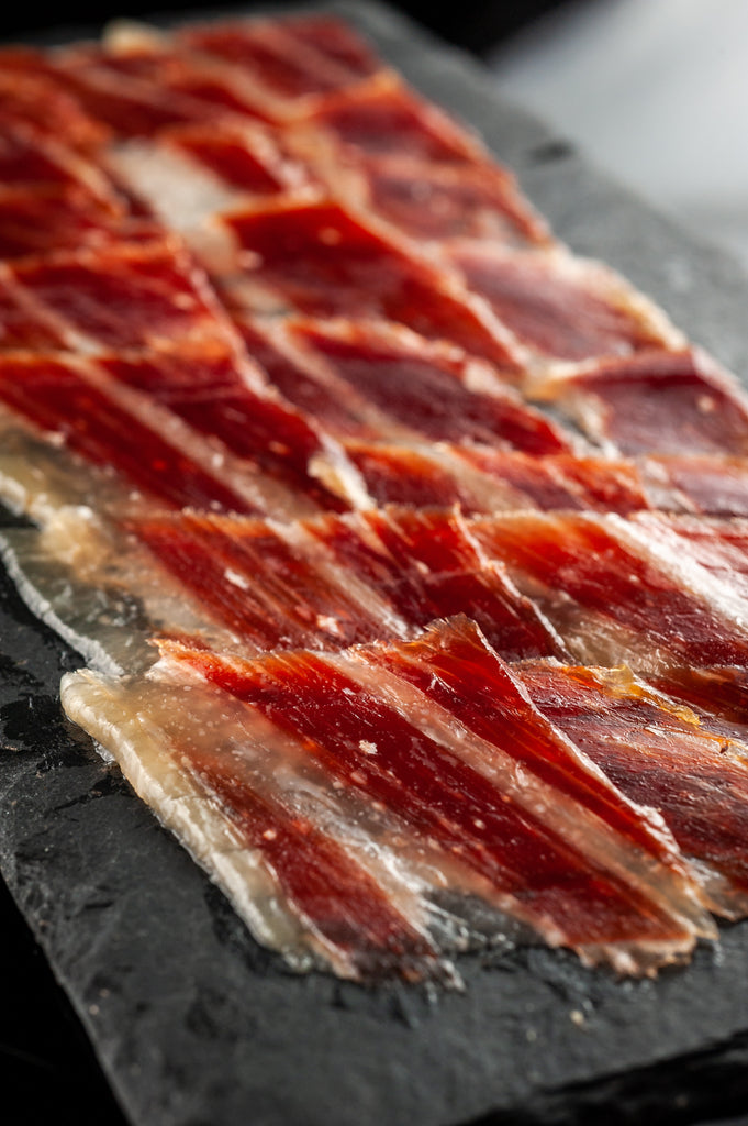 Acorn FEd Iberico Ham hand carved on a slate plate by Fermin. Deliberico