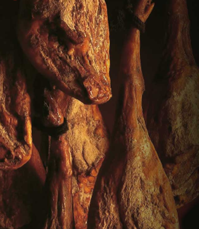 Iberico hams in curing cellar by Montaraz. Deliberico
