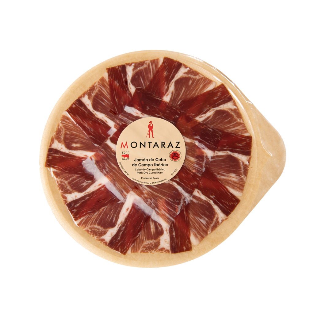 Free Range Iberico Acorn-fed Ham Hand Carved Style round packaged plate by Montaraz. Deliberico