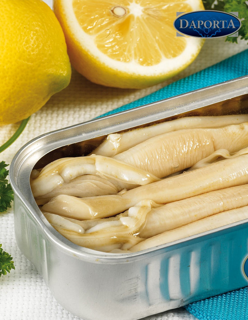 Razor Clams in brine by Daporta in open can next to lemons and parsley on an aqua and white linen. Deliberico